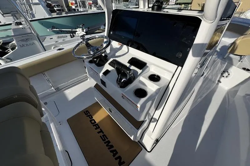  Yacht Photos Pics 2026 Sportsman Open 252 Center Console boat interior with steering wheel and control panel.