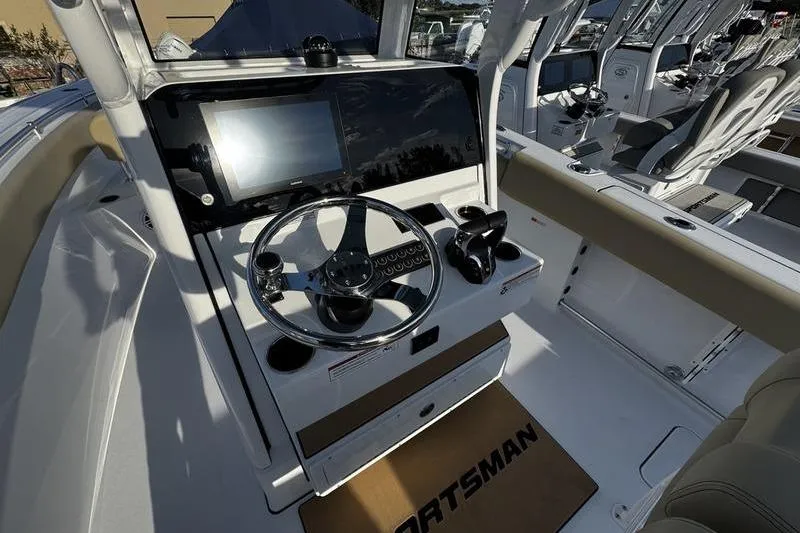  Yacht Photos Pics 2026 Sportsman Open 252 Center Console boat interior with modern steering and controls.