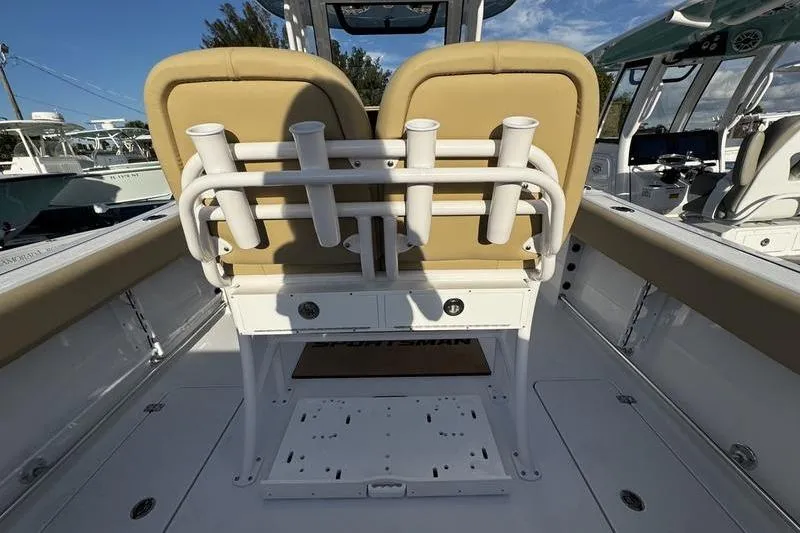  Yacht Photos Pics 2026 Sportsman Open 252 Center Console boat interior with rod holders and seating.