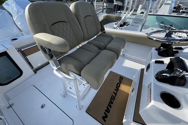  Yacht Photos Pics 2026 Sportsman Open 252 Center Console boat interior with cushioned seating and control panel.