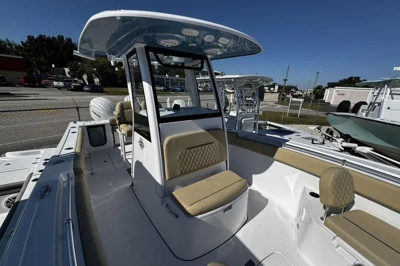  Yacht Photos Pics 2026 Sportsman Open 252 Center Console boat with beige seating and modern helm.