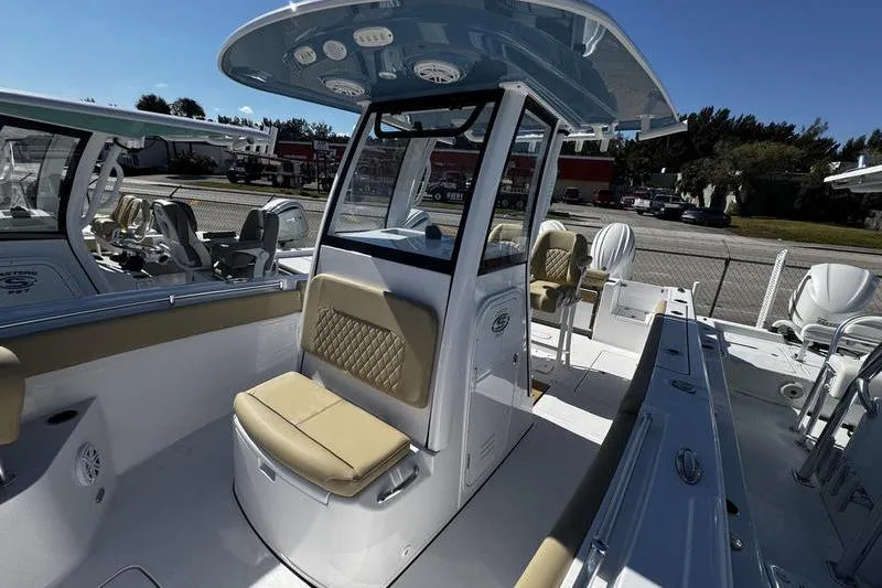  Yacht Photos Pics 2026 Sportsman Open 252 Center Console boat with beige seating and modern helm.