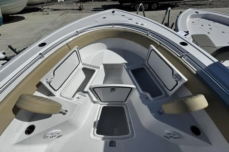  Yacht Photos Pics 2026 Sportsman Open 252 Center Console boat with open storage compartments and seating.