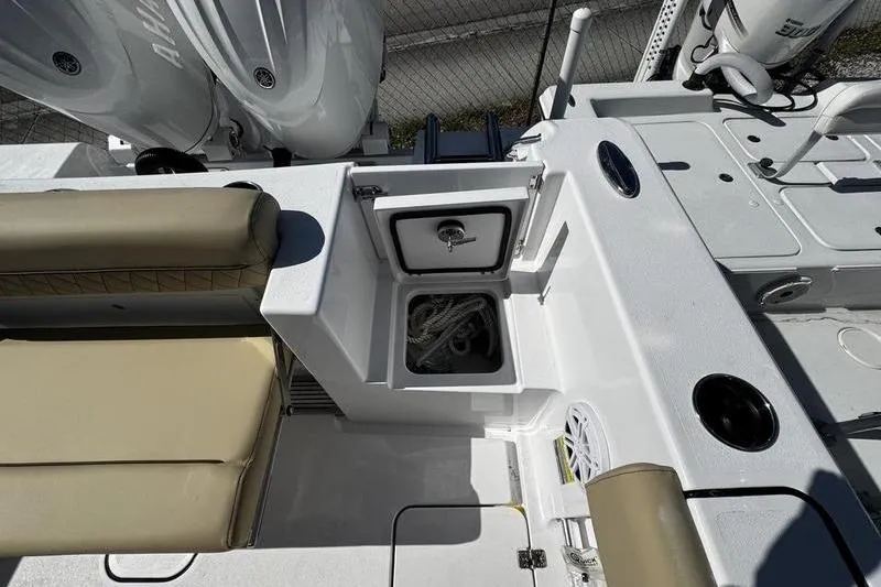  Yacht Photos Pics 2026 Sportsman Open 252 Center Console boat interior with storage compartment and seating.
