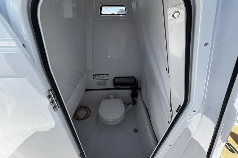  Yacht Photos Pics 2026 Sportsman Open 252 Center Console boat interior bathroom view.