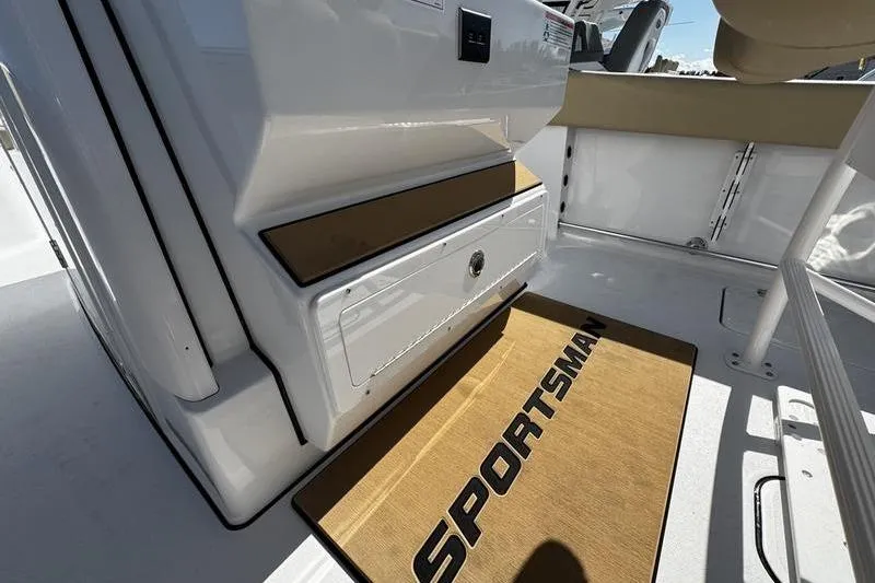  Yacht Photos Pics 2026 Sportsman Open 252 Center Console interior with branded mat and storage compartment.