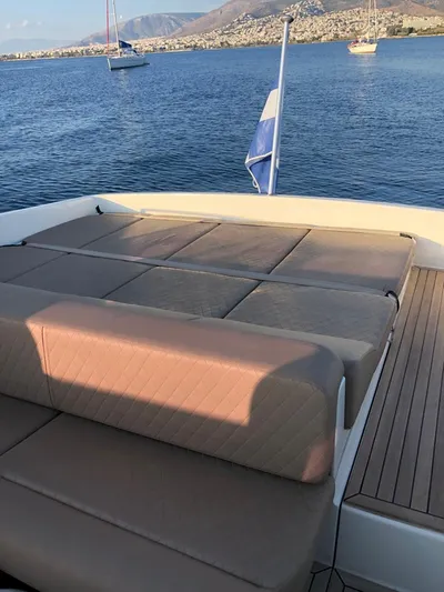  Yacht Photos Pics Otam 45 yacht deck with seating, 1997 model, overlooking calm sea and distant boats.