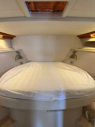  Yacht Photos Pics Interior cabin of a 1997 Otam 45 yacht with a cozy bed setup.