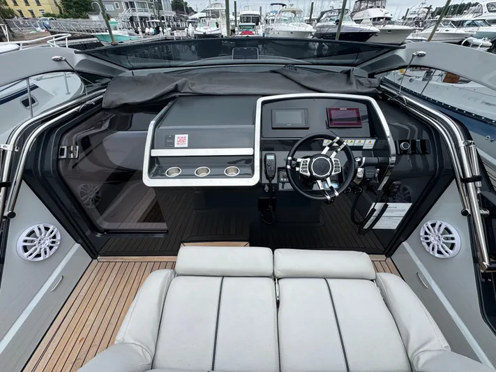  Yacht Photos Pics 2021 Fairline F//Line 33 yacht cockpit with modern steering and navigation controls.