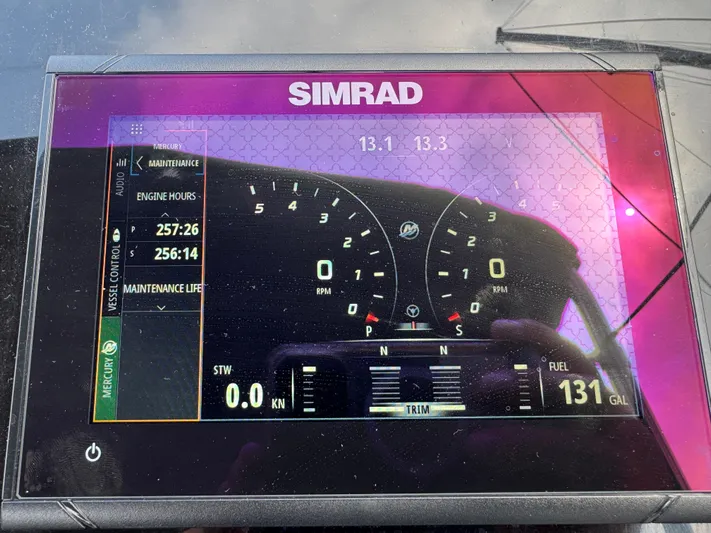  Yacht Photos Pics Simrad display on 2021 Fairline F//Line 33 showing engine hours and fuel level.