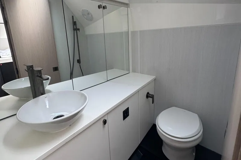  Yacht Photos Pics Modern bathroom in 2021 Fairline F//Line 33 yacht with sleek sink and toilet.