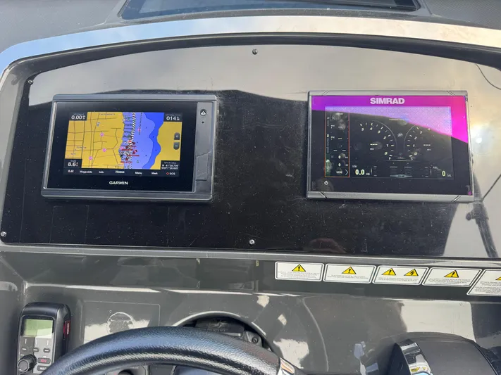  Yacht Photos Pics Dashboard of 2021 Fairline F//Line 33 with Garmin and Simrad navigation displays.
