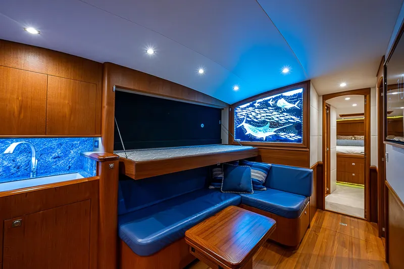 Boobah Yacht Photos Pics Luxurious 2017 F&S Custom Express Sportfish yacht interior with blue seating and wood accents.