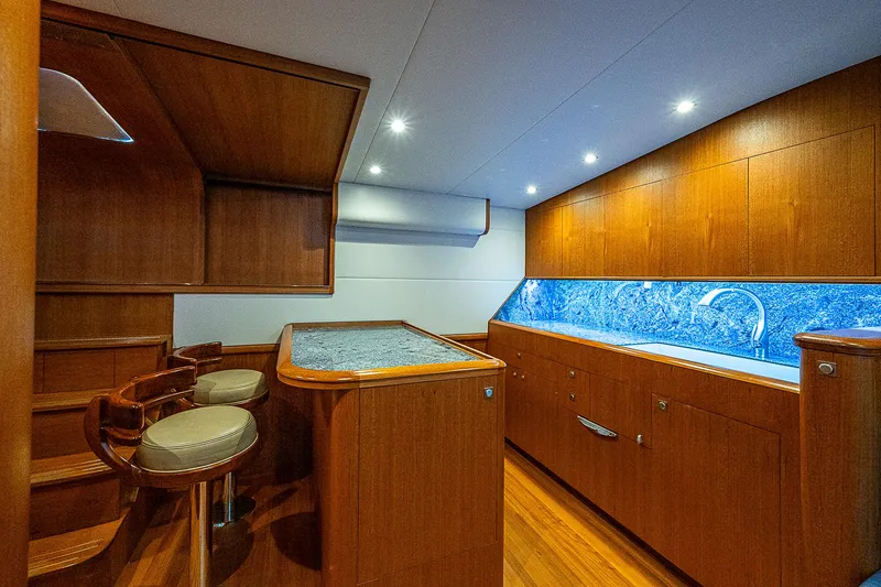 Boobah Yacht Photos Pics Luxurious 2017 F&S Custom Express Sportfish interior with elegant wood finish and modern lighting.