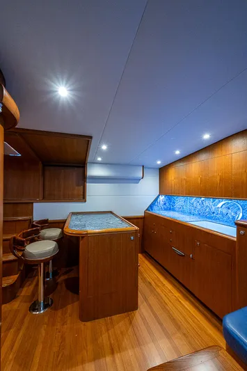 Boobah Yacht Photos Pics 2017 F&S Custom Express Sportfish interior with wood finish and blue accents.