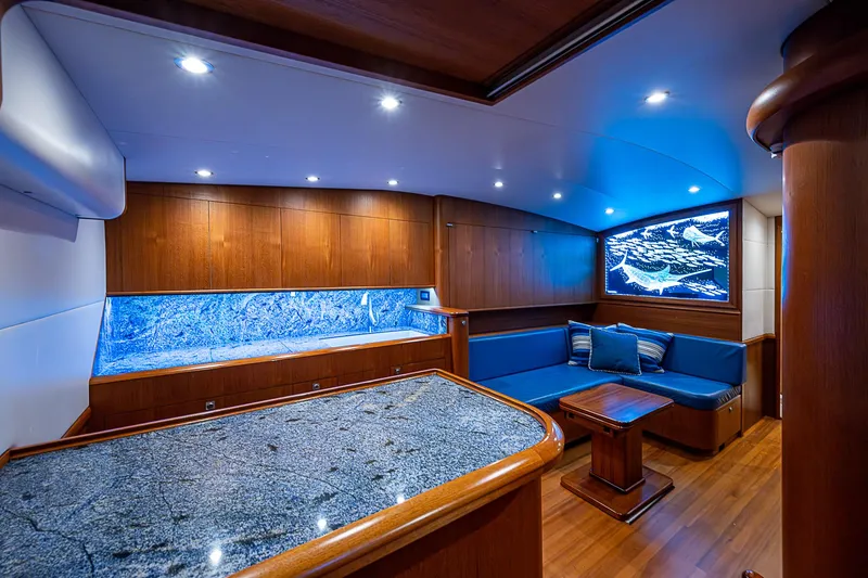 Boobah Yacht Photos Pics Luxurious 2017 F&S Custom Express Sportfish yacht interior with blue seating and wood finishes.