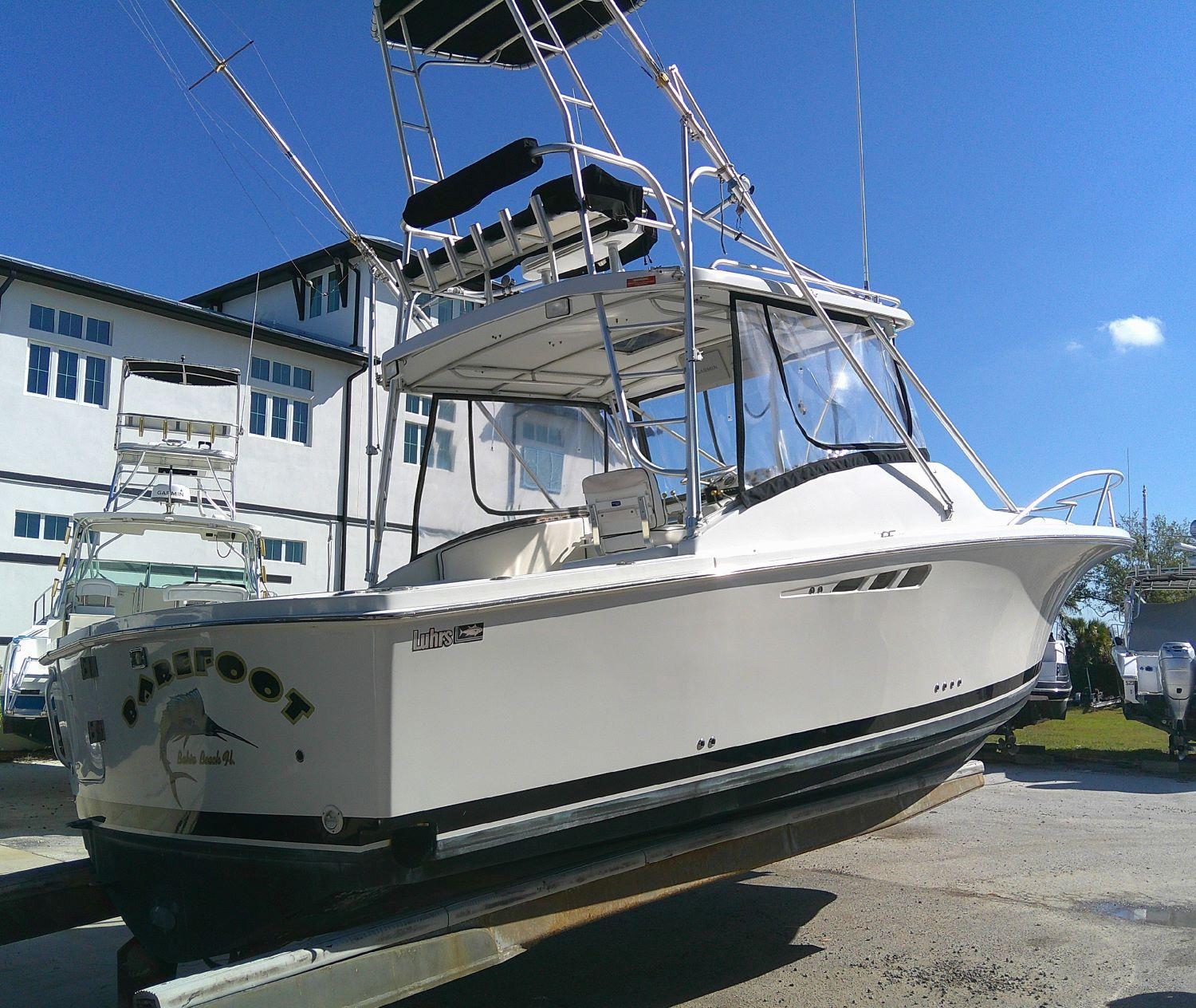 2000 Luhrs Tournament 290 Open boat on display, featuring sleek design and tower.