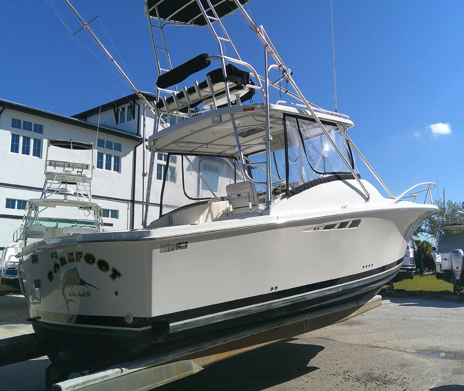 2000 Luhrs Tournament 290 Open boat on display, featuring sleek design and tower.