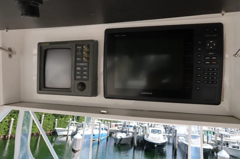 Doran Yacht Photos Pics 2002 Luhrs 40 Convertible boat electronics with Garmin display at marina.