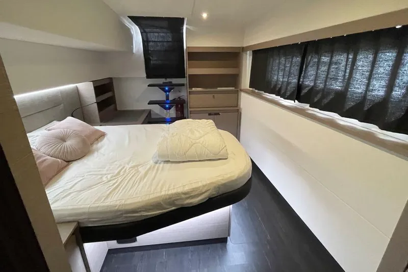 Maeva Yacht Photos Pics Luxurious bedroom interior of 2023 Fountaine Pajot Catamaran Aura 51 with modern design.