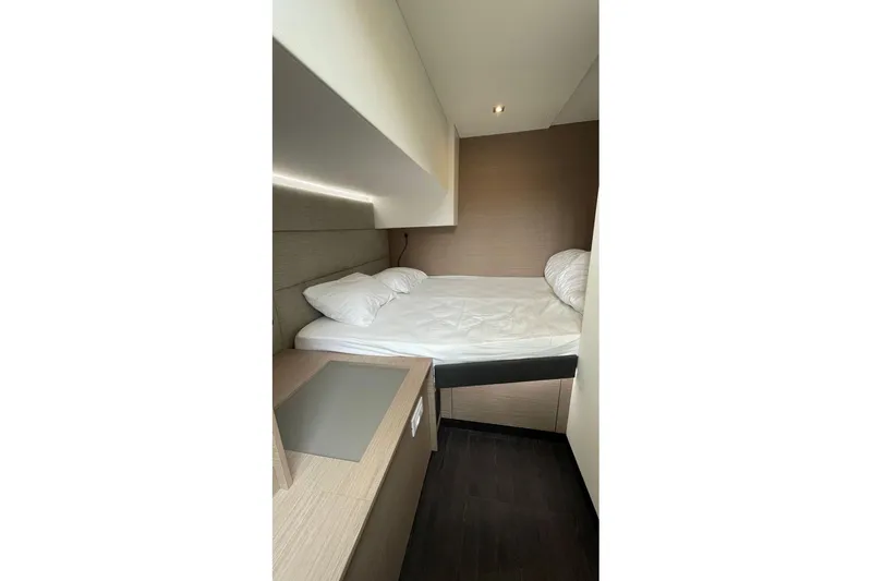 Maeva Yacht Photos Pics 2023 Fountaine Pajot Catamaran Aura 51 cabin interior with bed and modern design.