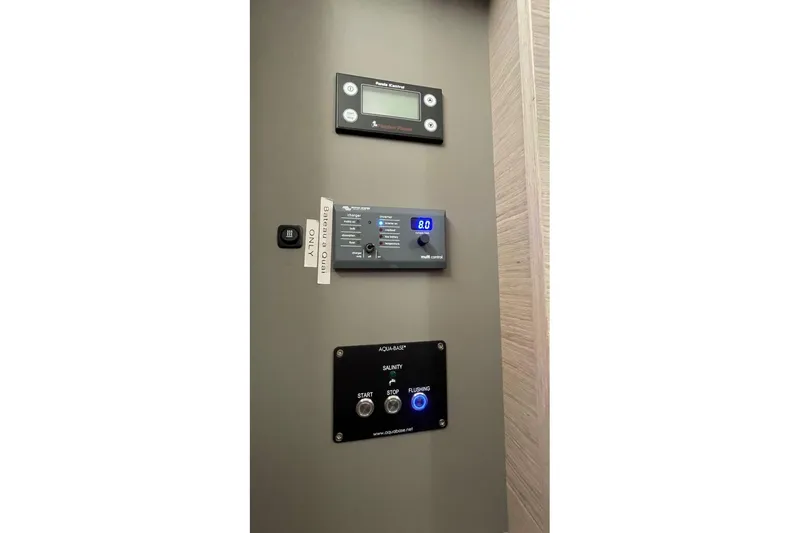 Maeva Yacht Photos Pics Control panel on 2023 Fountaine Pajot Catamaran Aura 51, featuring digital displays and buttons.