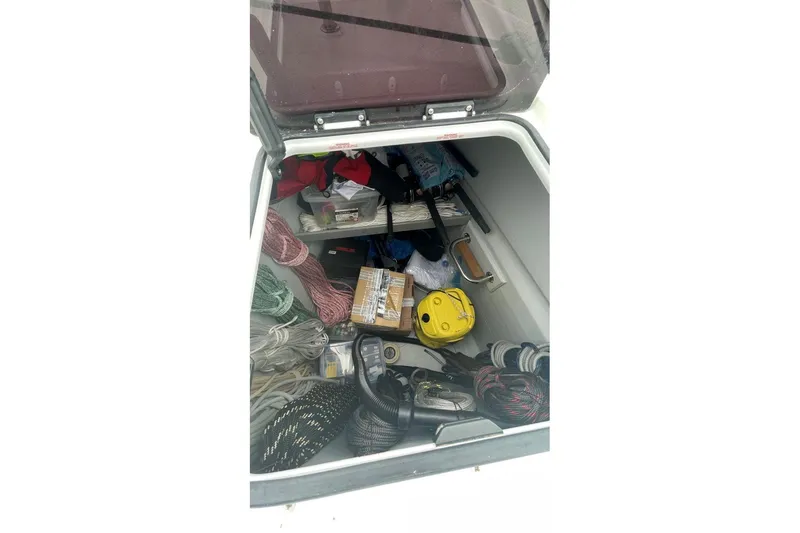 Maeva Yacht Photos Pics Storage compartment of 2023 Fountaine Pajot Catamaran Aura 51 with ropes and equipment.
