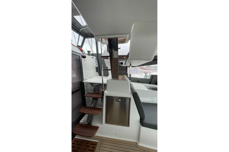 Maeva Yacht Photos Pics 2023 Fountaine Pajot Catamaran Aura 51 interior with modern design and wooden steps.