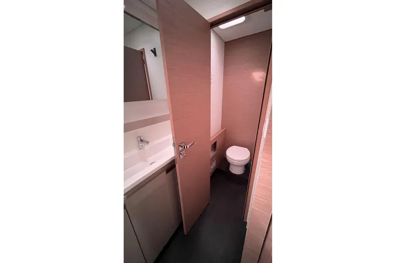Maeva Yacht Photos Pics 2023 Fountaine Pajot Catamaran Aura 51 bathroom with modern fixtures and sleek design.