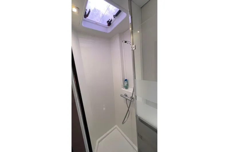Maeva Yacht Photos Pics Modern shower area in 2023 Fountaine Pajot Catamaran Aura 51 with skylight.