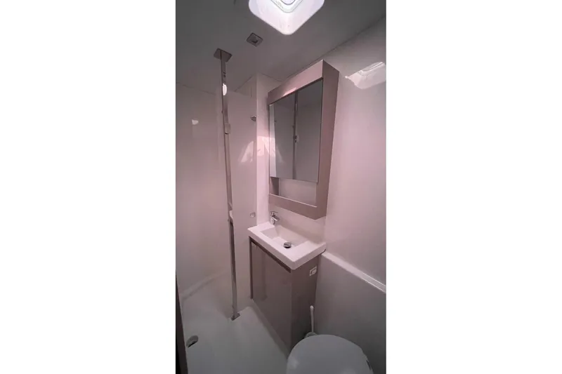 Maeva Yacht Photos Pics Modern bathroom in 2023 Fountaine Pajot Catamaran Aura 51, featuring sleek design and fixtures.