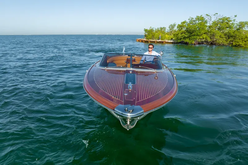 Mia Mia Yacht Photos Pics 2020 Riva Aquariva luxury boat cruising on clear blue waters.