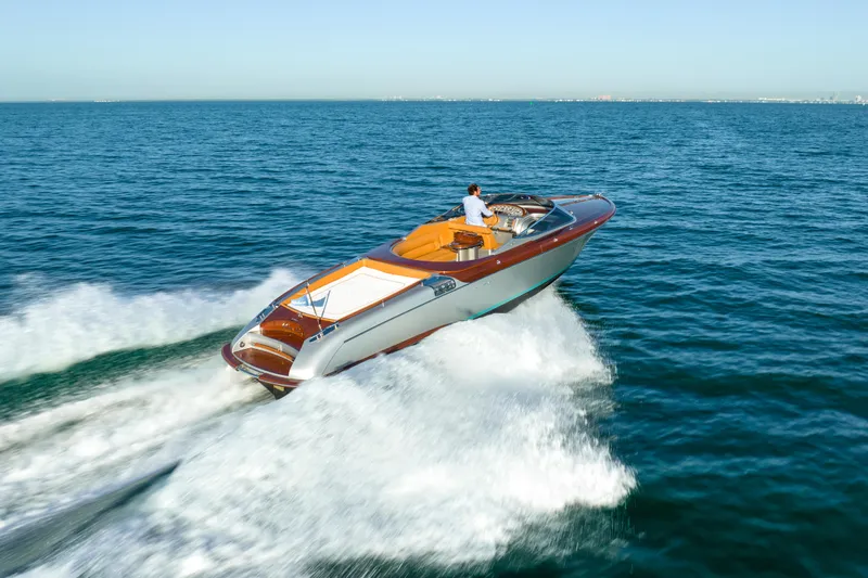 Mia Mia Yacht Photos Pics 2020 Riva Aquariva luxury speedboat cruising on open water.
