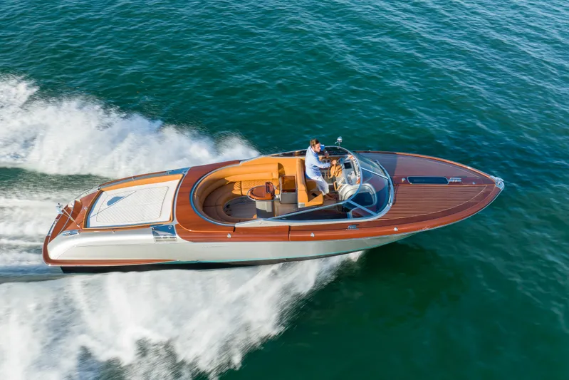 Mia Mia Yacht Photos Pics 2020 Riva Aquariva luxury speedboat cruising on open water.
