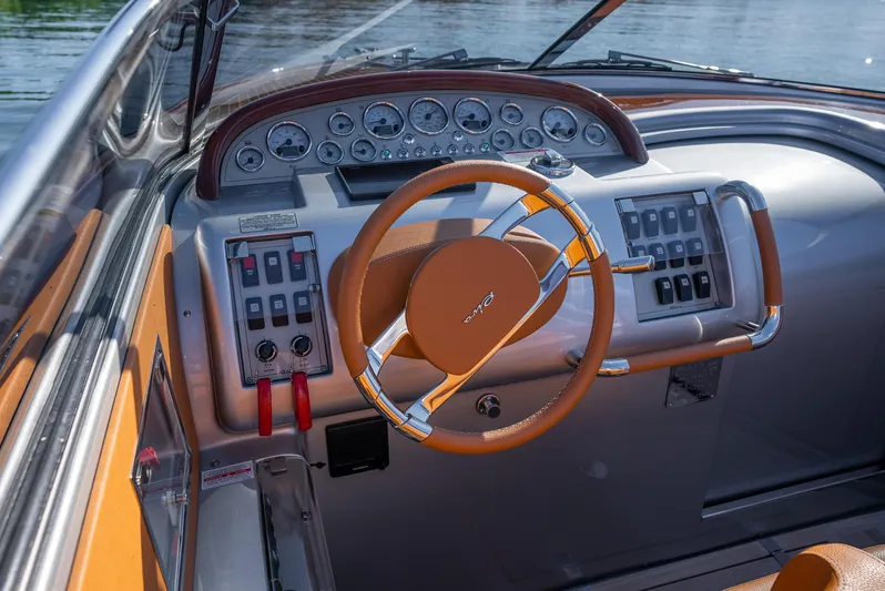 Mia Mia Yacht Photos Pics 2020 Riva Aquariva boat dashboard with steering wheel and control panel.