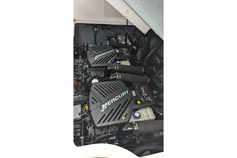  Yacht Photos Pics Twin Mercury engines in a 2004 Sea Ray 340 Sundancer boat.