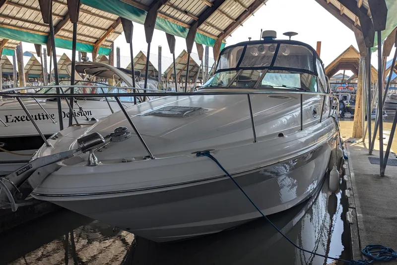  Yacht Photos Pics 2004 Sea Ray 340 Sundancer docked in a covered marina.