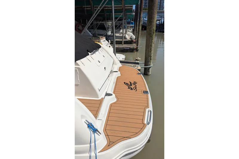  Yacht Photos Pics 2004 Sea Ray 340 Sundancer docked, showcasing teak swim platform and sleek design.