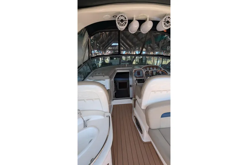  Yacht Photos Pics Interior view of 2004 Sea Ray 340 Sundancer boat with seating and dashboard.