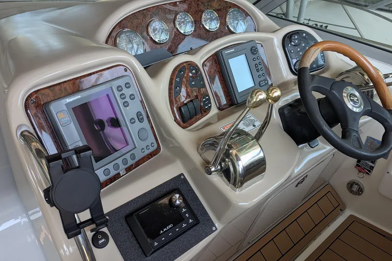  Yacht Photos Pics Control panel of a 2004 Sea Ray 340 Sundancer boat with navigation instruments.