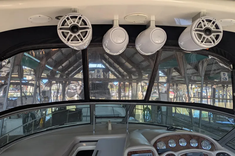  Yacht Photos Pics Interior view of 2004 Sea Ray 340 Sundancer boat with speakers and dashboard.