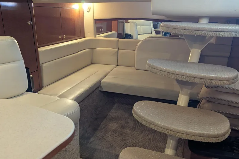  Yacht Photos Pics Luxurious interior of 2004 Sea Ray 340 Sundancer yacht with plush seating and elegant design.