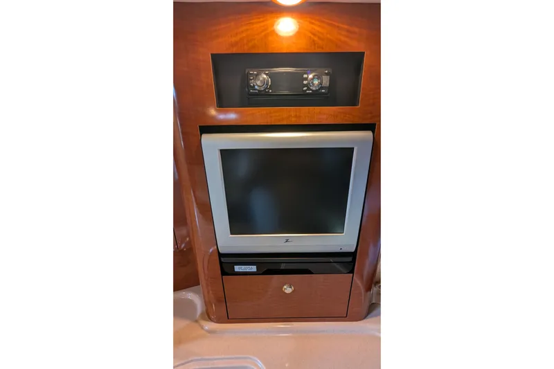  Yacht Photos Pics 2004 Sea Ray 340 Sundancer interior with built-in TV and stereo system.