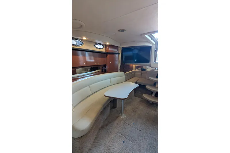  Yacht Photos Pics Luxurious interior of 2004 Sea Ray 340 Sundancer yacht with plush seating and modern amenities.