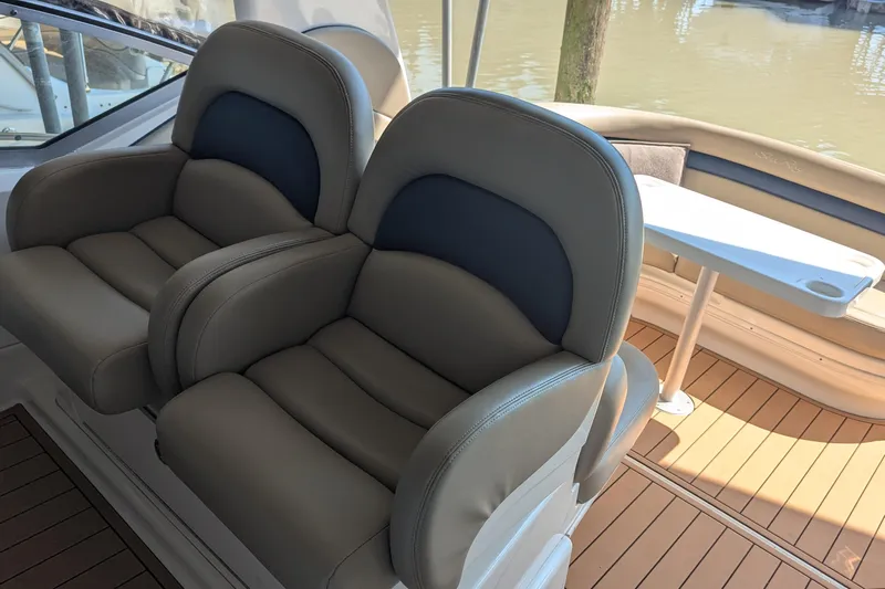  Yacht Photos Pics Luxury seating on 2004 Sea Ray 340 Sundancer boat with elegant interior design.