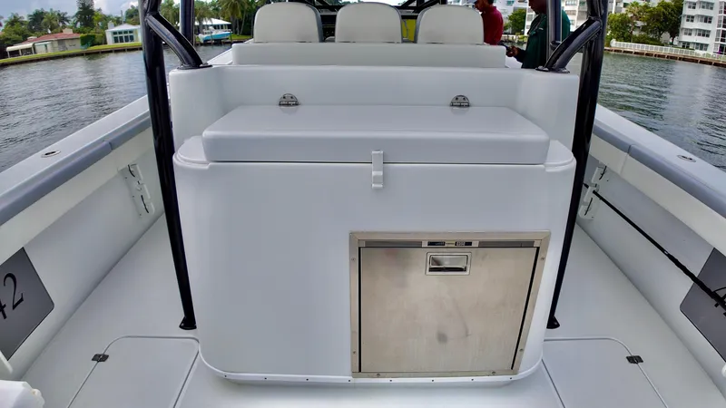  Yacht Photos Pics 2022 Yellowfin 42 Offshore boat interior with seating and storage.