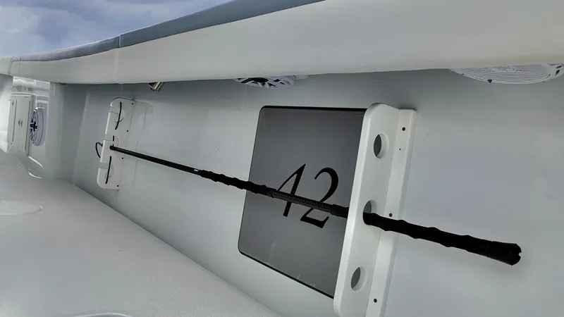  Yacht Photos Pics 2022 Yellowfin 42 Offshore boat interior detail with rod holder and number 42.