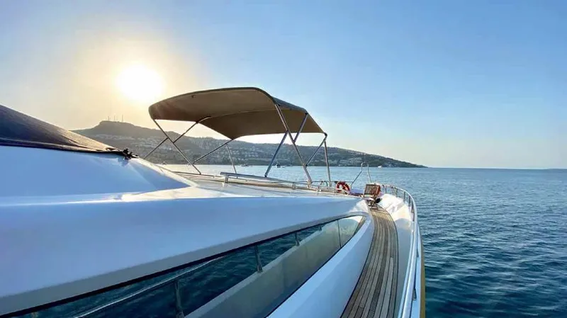 Vedo Yacht Photos Pics Bilgin 30 meter yacht cruising at sunset, 2004 model, serene ocean view.