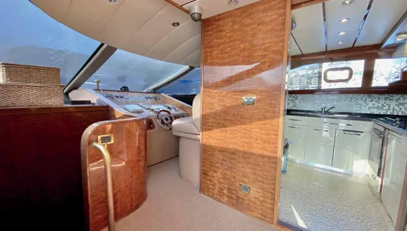 Vedo Yacht Photos Pics Luxurious interior of a 2004 Bilgin 30-meter yacht with modern helm and kitchen area.