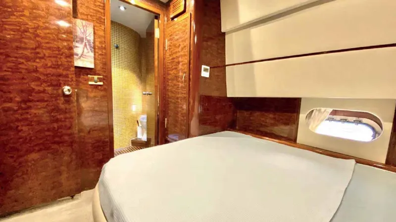 Vedo Yacht Photos Pics Luxurious cabin interior of 2004 Bilgin 30 meter yacht with wood paneling and ensuite bathroom.